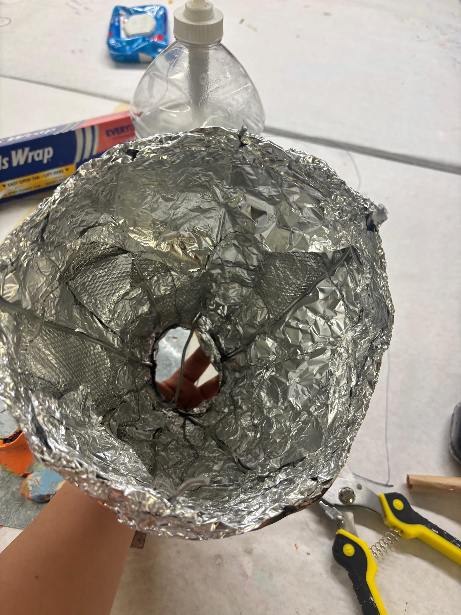 Foil-wrapped head form in progress